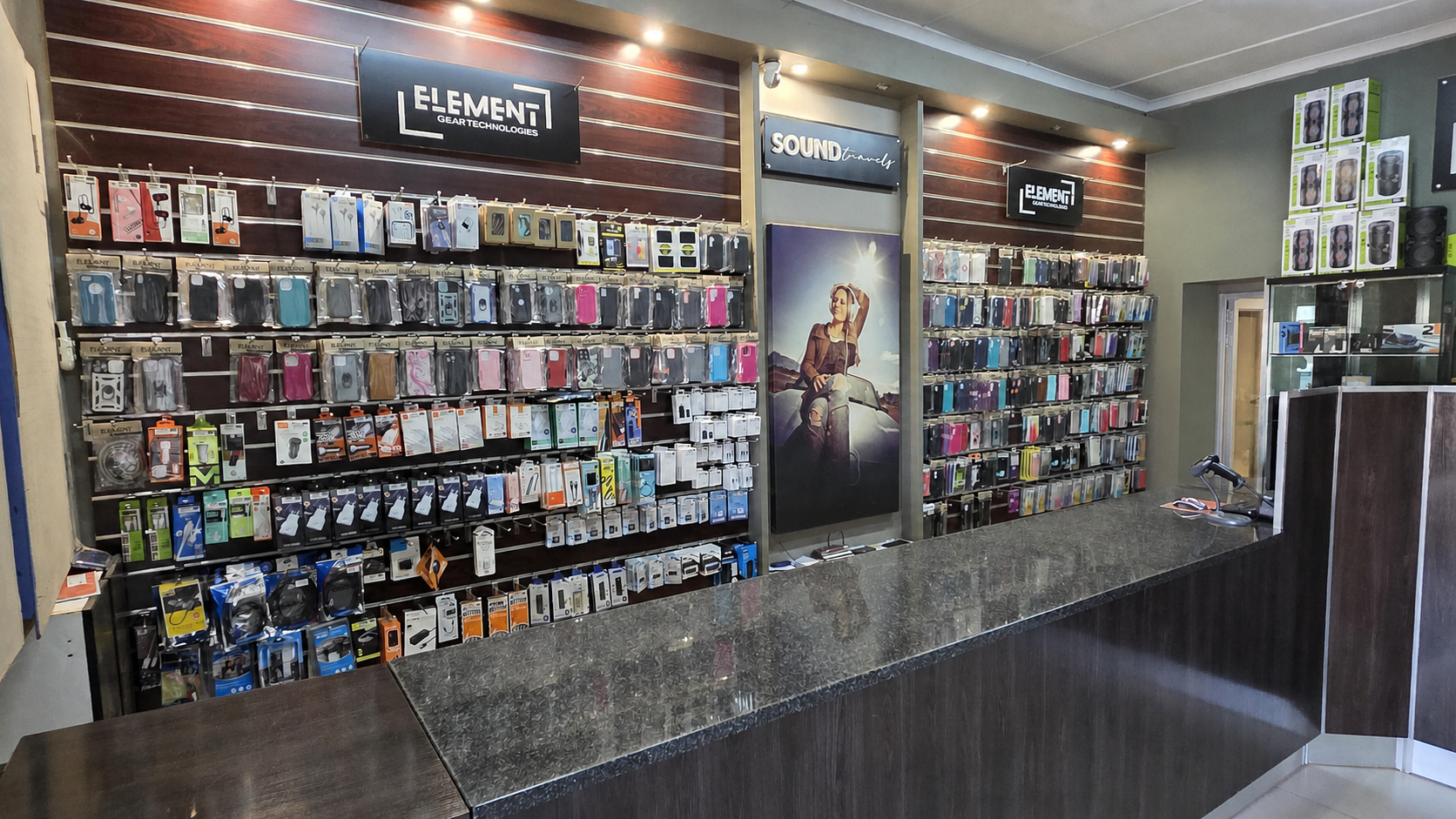 Element Gear Tech showroom with painted wall and mobile accessories